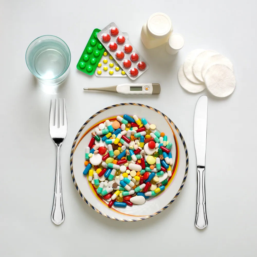 Colorful medications arranged on a plate, highlighting pediatric compounding solutions from a pediatric compounding pharmacy for personalized children's prescriptions.