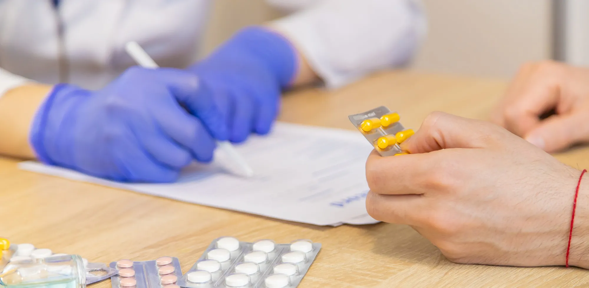 Healthcare professional reviewing low dose naltrexone treatment options with customized LDN compounding pharmacy prescriptions