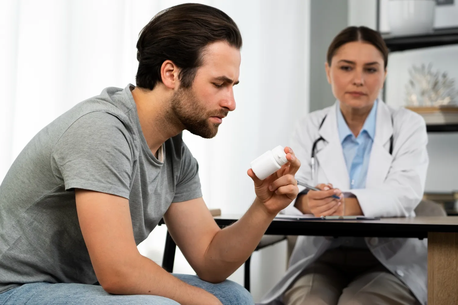 Patient consulting with healthcare provider about low dose naltrexone treatment and LDN compounding pharmacy services