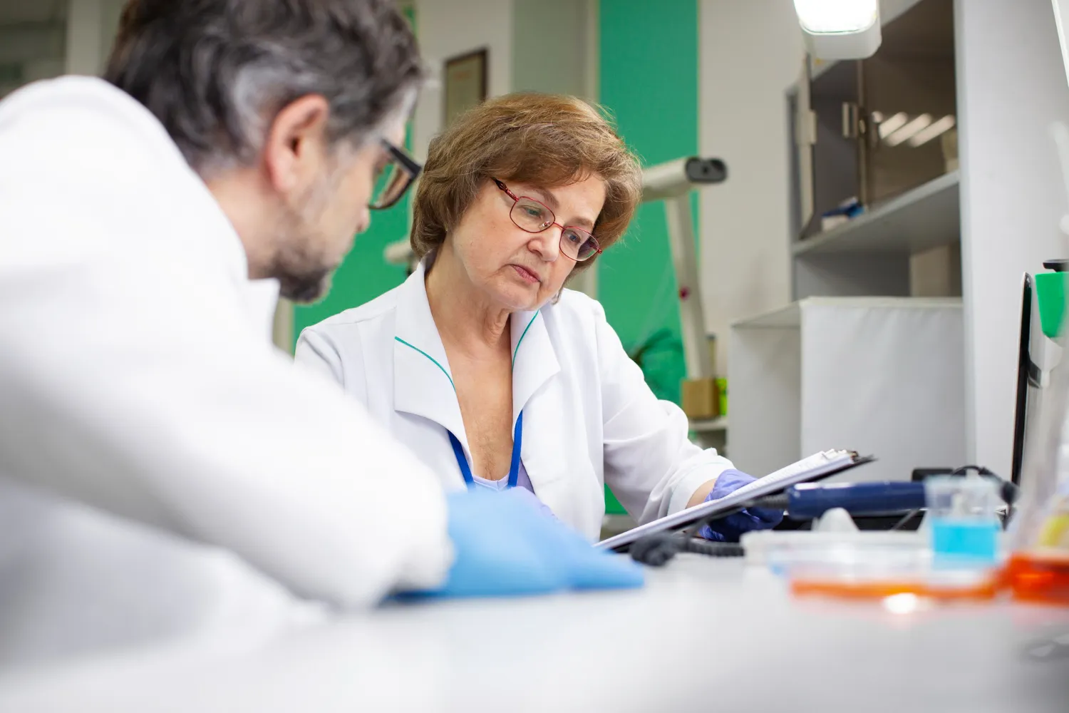 Pharmacists reviewing prescription formulations at a Compounding Pharmacy Jacksonville, ensuring accurate compounded medications, quality standards, and customized patient treatment plans.