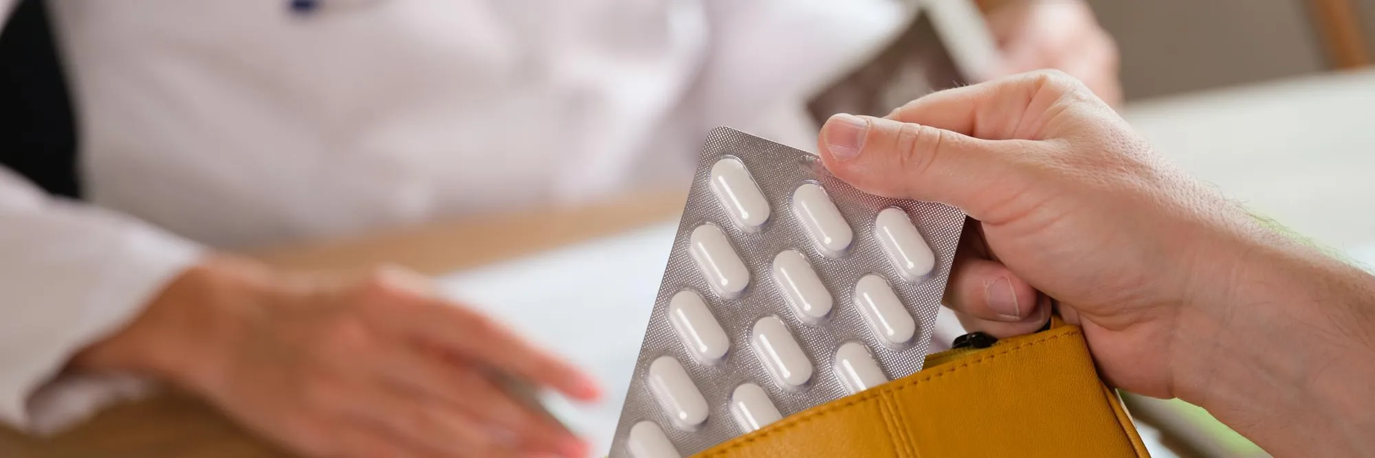 Patient holding prescribed medication during a hormone therapy Jacksonville consultation for hormone health treatment Jacksonville.