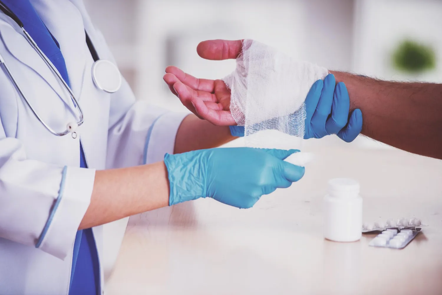 Healthcare provider applying a sterile bandage during treatment while recommending Quick Wound Healing Medicines to promote faster recovery, infection prevention, and effective wound management.